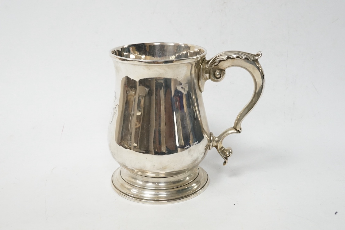 A late George II silver baluster pint mug, maker, ?B, London, 1759, with later engraved monogram(erasure), height 12cm, 13.8oz. Condition - poor to fair